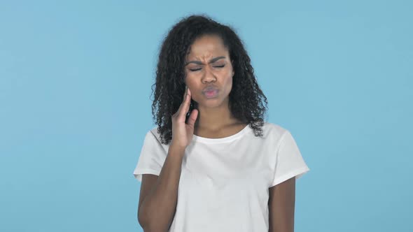 Toothache African Girl with Tooth Pain Isolated on Blue Background