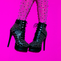 Fashion legs in heel black boots on pink  minimal background. Stylish accessories shoes concept - PhotoDune Item for Sale