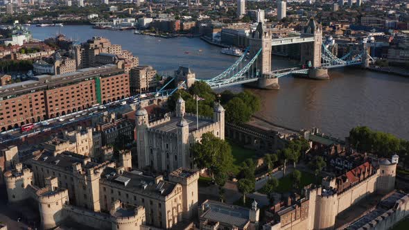 Aerial View of Medieval Royal Castle Tower of London and Tower Bridge Spanning River Thames