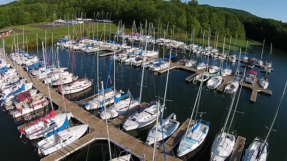 Aerial footage of sailboat marina.