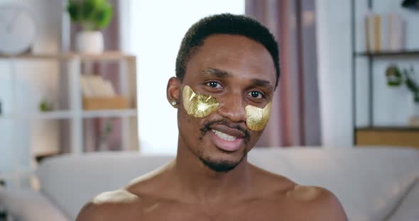 African American Looking at Camera with Collagen Refreshing Patches Under Eyes