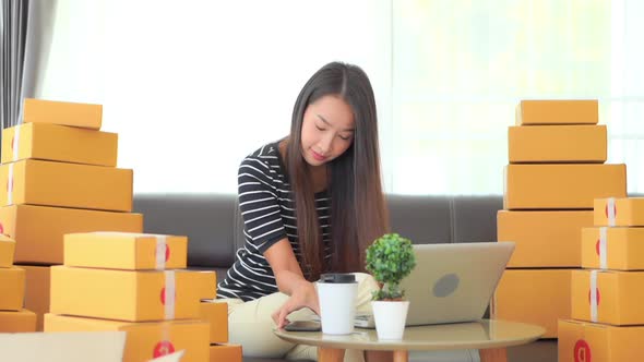 Woman with packing box ready for shipping