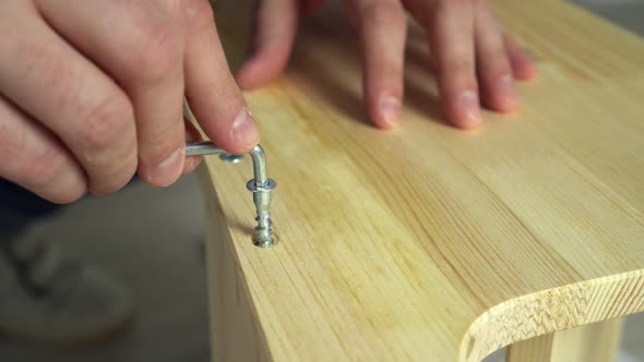 Closeup Hands Assembling Wooden Furniture