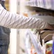 Close-up of Young Girl Steals Chocolate Bar From the Shelf in the Grocery Store. - VideoHive Item for Sale