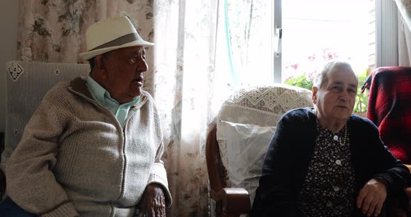 Elderly couple together at home