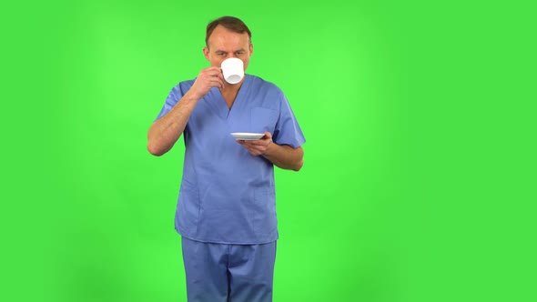 Medical Man Drinks Unpalatable Coffee and Is Disgusted. Green Screen