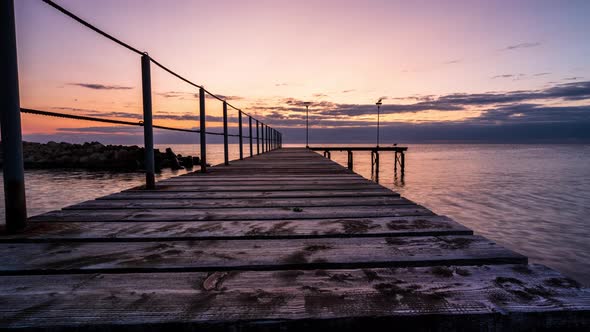 Rising sun and wooden bridge