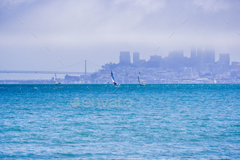 tially covered by fog in the background; view from Sausalito, California