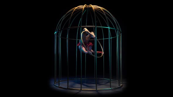 Aerial Acrobatics on a Spinning Hoop in a Cage. Black Background