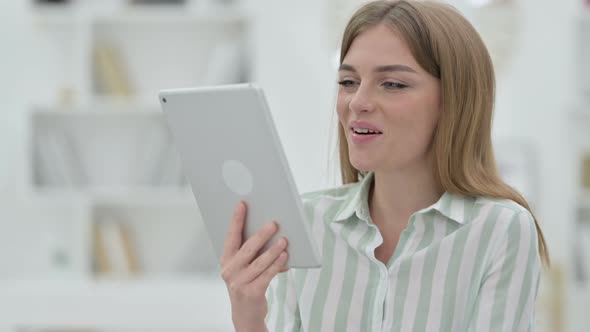 Portrait of Young Woman Doing Video Call on Digital Tablet 