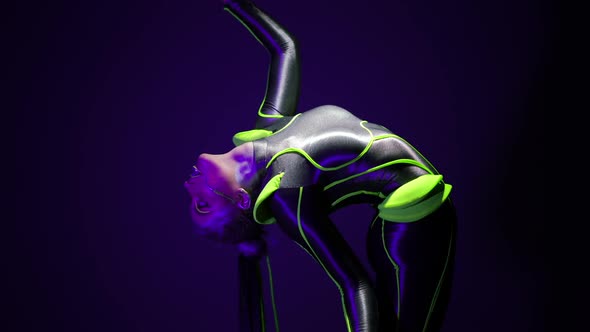 Flexible Slim Woman Bending Back Raising Leg Standing on Cube in Ultraviolet Light