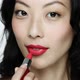 Young woman applying red lipstick - VideoHive Item for Sale