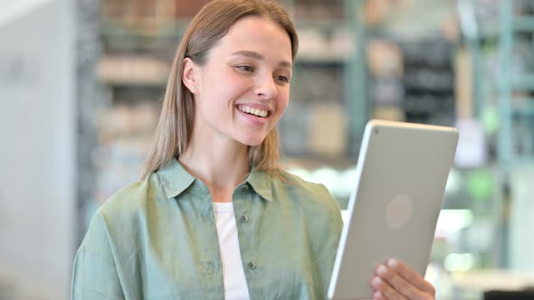 Portrait of Woman Doing Video Chat on Digital Tablet 