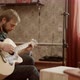 Adult Men Playing Guitars at Home - VideoHive Item for Sale