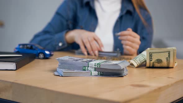 Young Female Hands Counting Money.