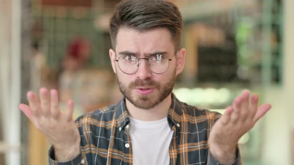 Portrait of Upset Young Man Feeling Angry