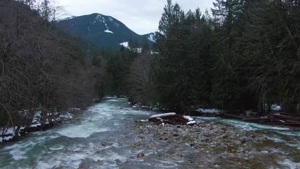 Aerial View of Chilliwack River with Snow During Winter Season