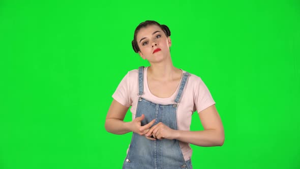 Girl Stands Waiting on a Green Screen