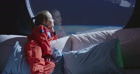 Girl Looking Out of Spaceship Window