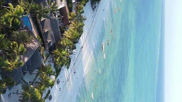 Vertical Video Boats in the Ocean Near the Coast of Zanzibar Tanzania Aerial View