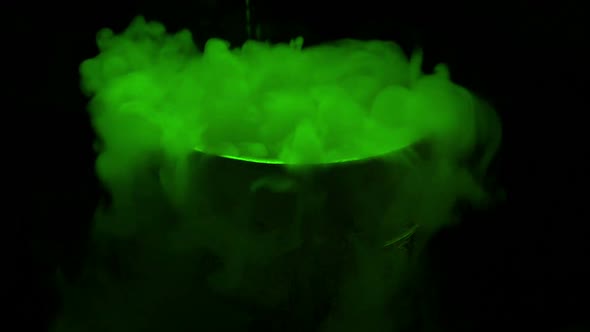 Green Bubbling Potion Is Poured Into Goblet