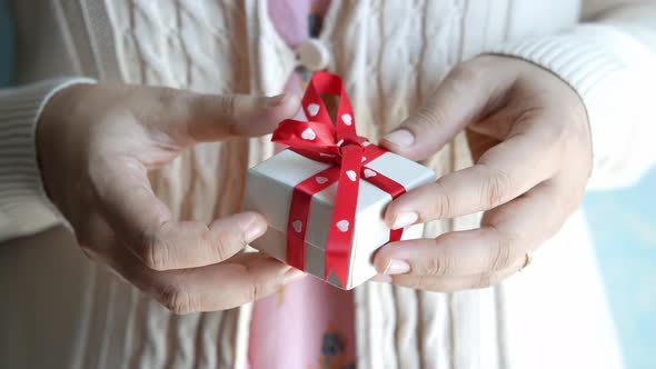 Women Hand Holding a Gift Box