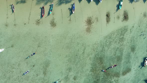 Top view tropical sea with longtail fishing boats