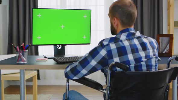 Green Mockup in Front of Disabled Person