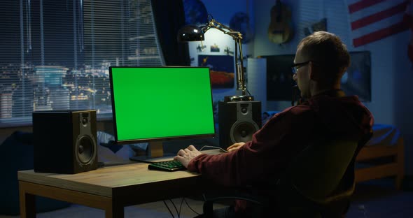 Man Using His Computer at Home