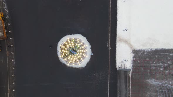 Beautiful Christmas Tree with Garlands on a City Street Top View