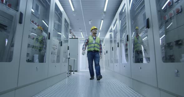 Electrical Worker Walking Down the Hall