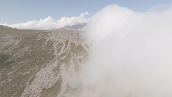 Scenic aerial view of moving white clouds in Abuli Mountain. Georgia