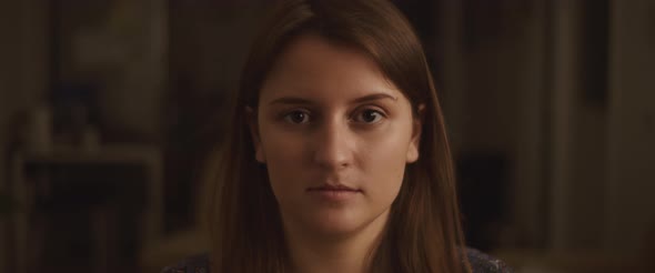 Close up Of a Young Woman with Eyes Wide Open Looking to The Camera