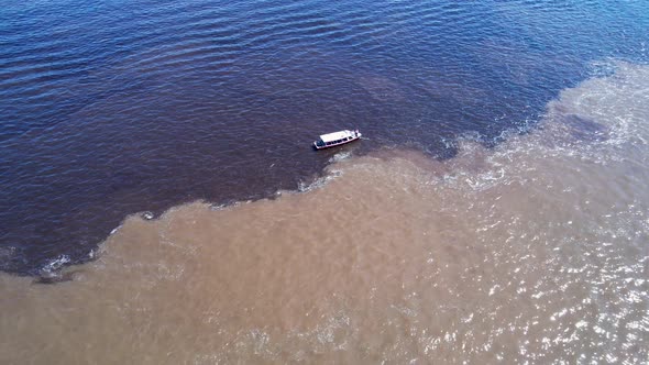 Famous Meeting of the Waters tourism landmark at Manaus Brazil.