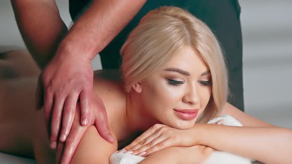 Young Woman Having Massage in Spa Salon