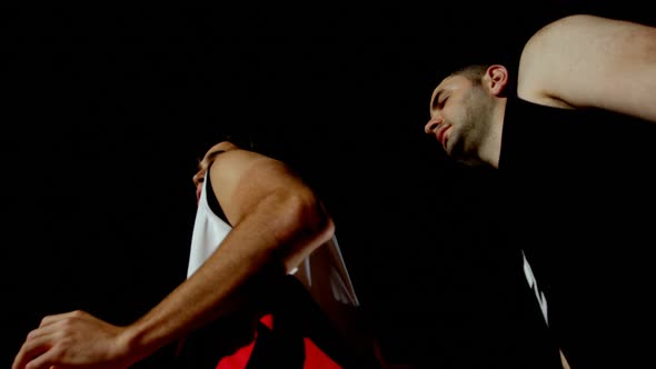 Competitors playing basketball in the court 4k