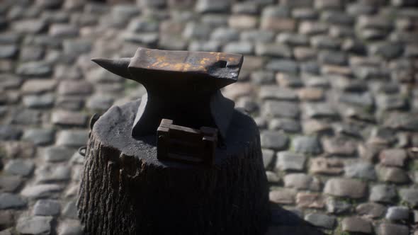 Old Anvil Attached To a Stump alt