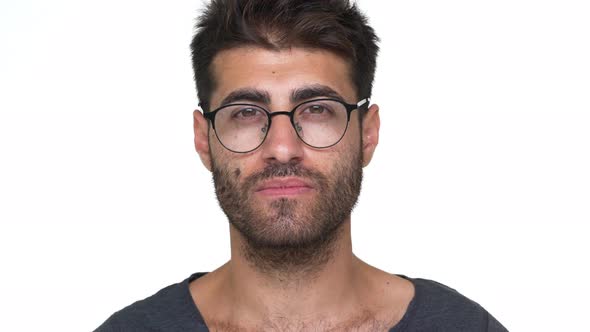 Hispanic Bearded Guy in Glasses with Chest Hair Under Grey Tshirt Nodding Positively Being Glad