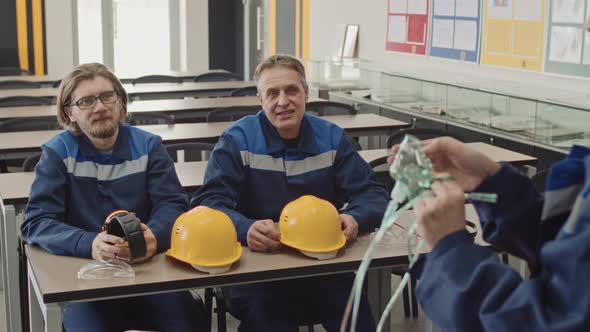 Plant Workers Listening To Safety Precautions At Workplace