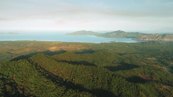 Slow Motion Aerial Over Mountain Green Forest