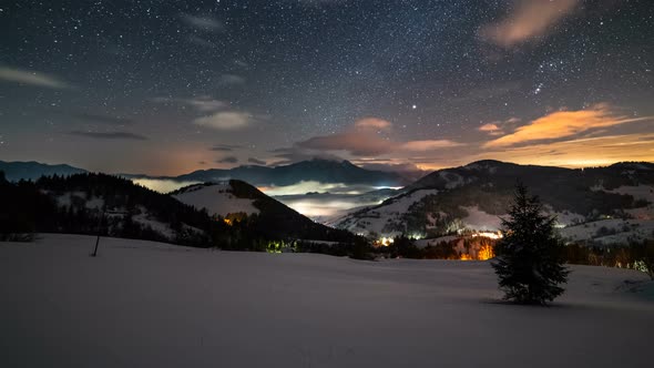 Starry Night Sky with Stars and Colorful Clouds over Winter Mountains Landscape