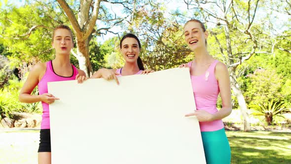 Group of volunteers holding a blank sheet