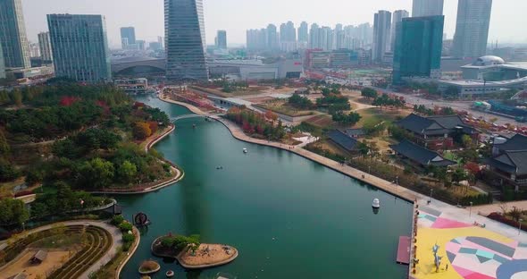 Aerial view of modern city skyline and lake park