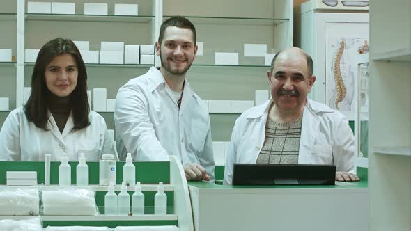 Portrait of a Pharmaceutical Team Smiling and Looking at Camera