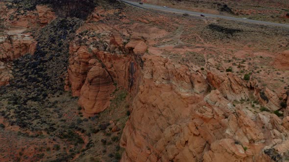 Aerial Drone footage of the mountainous red rocks in southern Utah. Showing the sky, the mountains,