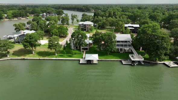 Lakefront homes in USA. Aerial of houses on water with private boat docks.