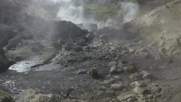 Volcanic Hot Springs Gas, Steam and Flowing Stream with Thermal Water