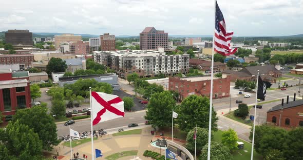 Huntsville, Alabama skyline with Alabama state flag and United States of America flag flying.