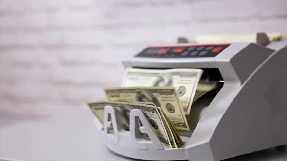 Counting machine for USD dollar paper banknote. Banknote counter.