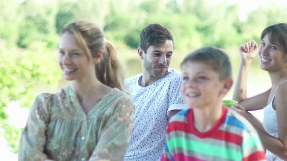 Family and friends sitting together outdoors